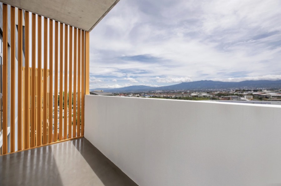 Listing photo of a balcony view over the city and mountains